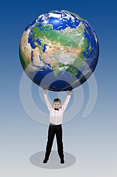 Boy holding in his hands over his head a large globe