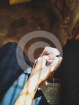 A boy holding a holybook in hands while sitting