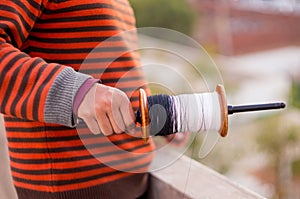 Boy holding a kite flying spool