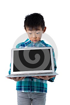 Boy holding laptop