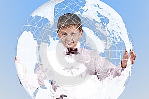 Boy holding a large translucent globe