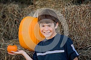 Boy Holding a Little Pumpkin