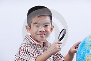 Boy holding magnifying glass