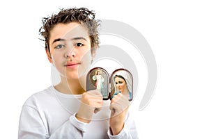 Boy holding Merciful Jesus and Our Lady of Medjugorje icon
