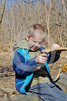 Boy holding a mushroom tinder