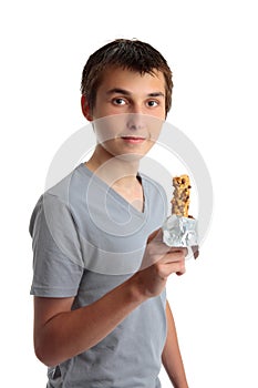 Boy holding a nutritional snack bar