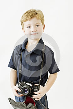 Boy holding professional camera photo