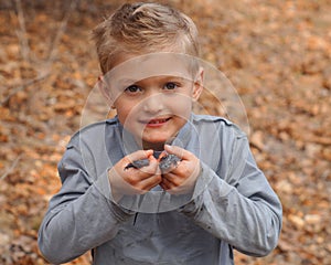 Boy holding salamanders