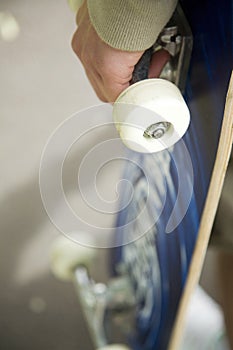 Boy holding skateboard. Conceptual image shot