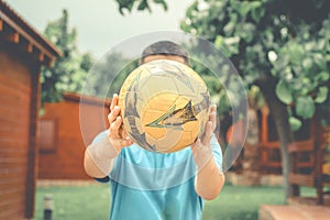 Boy holding a soccer ball