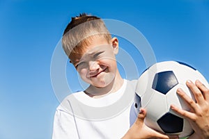 Boy holding a soccer ball