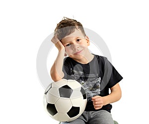 Boy holding soccer ball and recreation