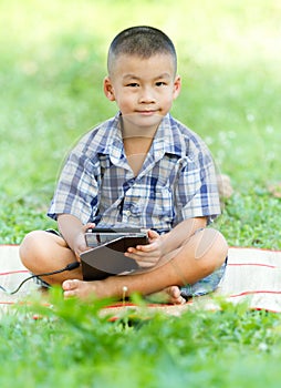 Boy holding tablet PC