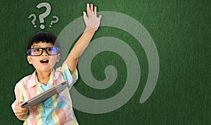 Boy holding tablet raise his hand up for question