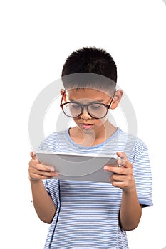 Boy holding tablet.