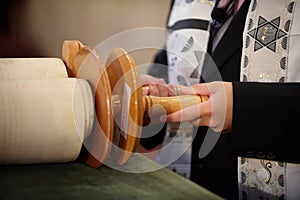 Boy holding Torah scrolls