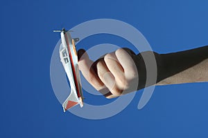 Boy holding toy airplane