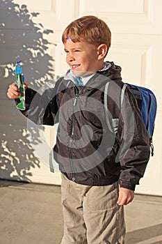 Boy is holding a toy foam airplane