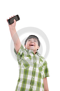 Boy holding up cellular phone