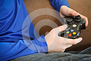 Boy holding video game controller