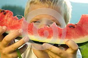 Boy holding watermelon