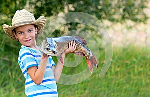 Boy holds big fish