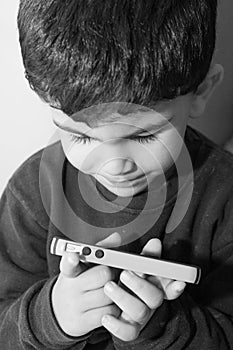 Boy holds celular phone photo