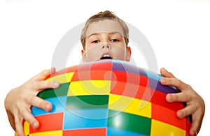 Boy holds before itself big inflatable ball