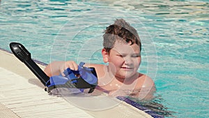 Boy holds mask