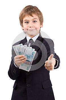 The boy holds money, isolated