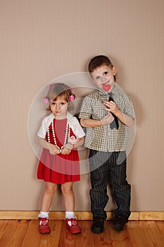 Boy holds red heart for girl