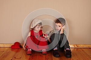 Boy holds red heart for girl