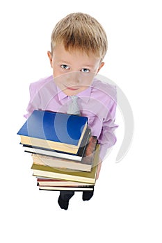 Boy holds a stack of books