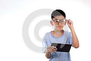 Boy holds tablet.