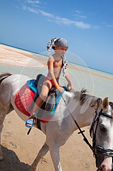 Boy on horseback photo