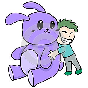 A boy is hugging a big stuffed rabbit