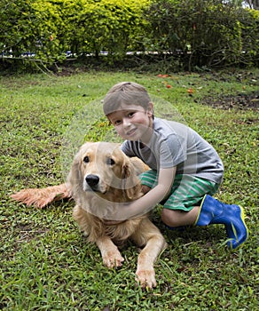 Boy Hugging the Dog.