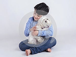 boy hugging his dog