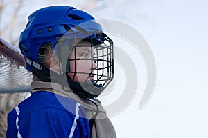 Boy ice hockey player plays hockey