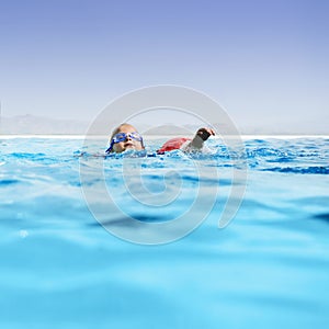 Boy in infinity pool photo