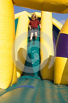 Boy on Inflatable Slide