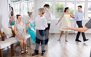 Boy invites girl to dance waltz