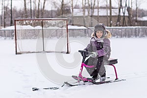 Boy in jacket walking in winter, ice skating,