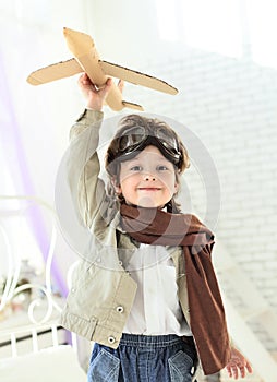 boy with jet airplane in hand