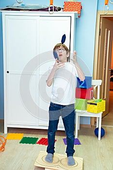 A boy on balancing platform sensory integration photo