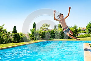 Boy jump in mid air into swimming pool screaming