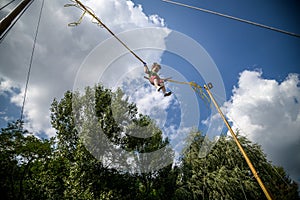 The boy is jumping on a bungee trampoline. A child with insuranc