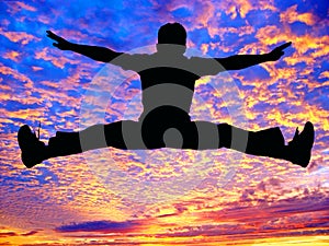 Boy jumping high in the air