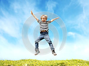 Boy jumping in meadow