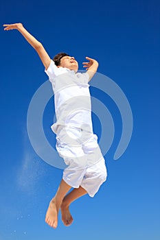 Boy jumping in midair photo